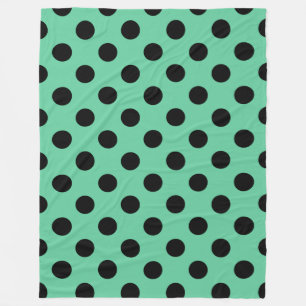 Zwarte polka-punten op muntgroen fleece deken