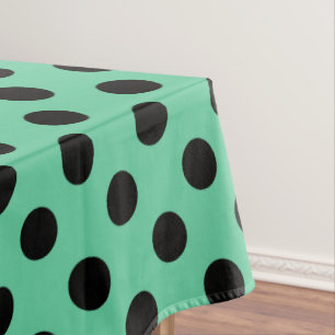 Zwarte polka-punten op muntgroen tafelkleed