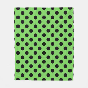 Zwarte polka-stippen op kalkgroen fleece deken