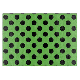 Zwarte polka-stippen op kalkgroen snijplank