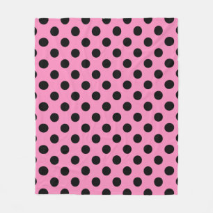 Zwarte polka-stippen op roze fleece deken