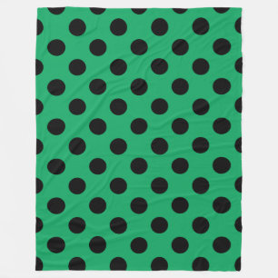 Zwarte polka-stippen op vers groen fleece deken