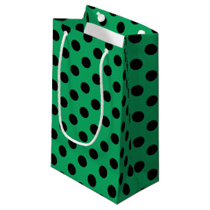 Zwarte polka-stippen op vers groen klein cadeauzakje