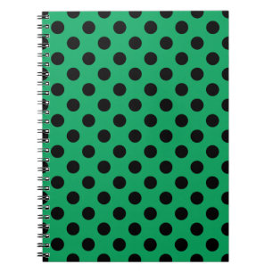 Zwarte polka-stippen op vers groen notitieboek