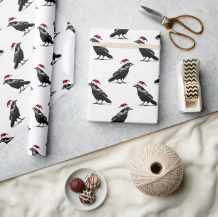 Zwarte raaf met rode kerstman hoed patroon cadeaupapier