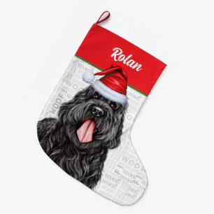 Zwarte Russische terriër met de naam van de hond Grote Kerstsok