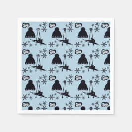 Zwarte ski-uitrusting & sneeuwvlokken op blauw servet