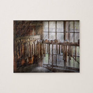 Zwarte Smid - Trekplaten en hamers Legpuzzel