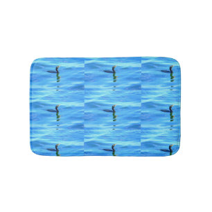 zwemaalscholvers in blauw zee badmat