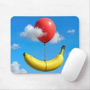 Zwevende banaan en rode ballon muismat
